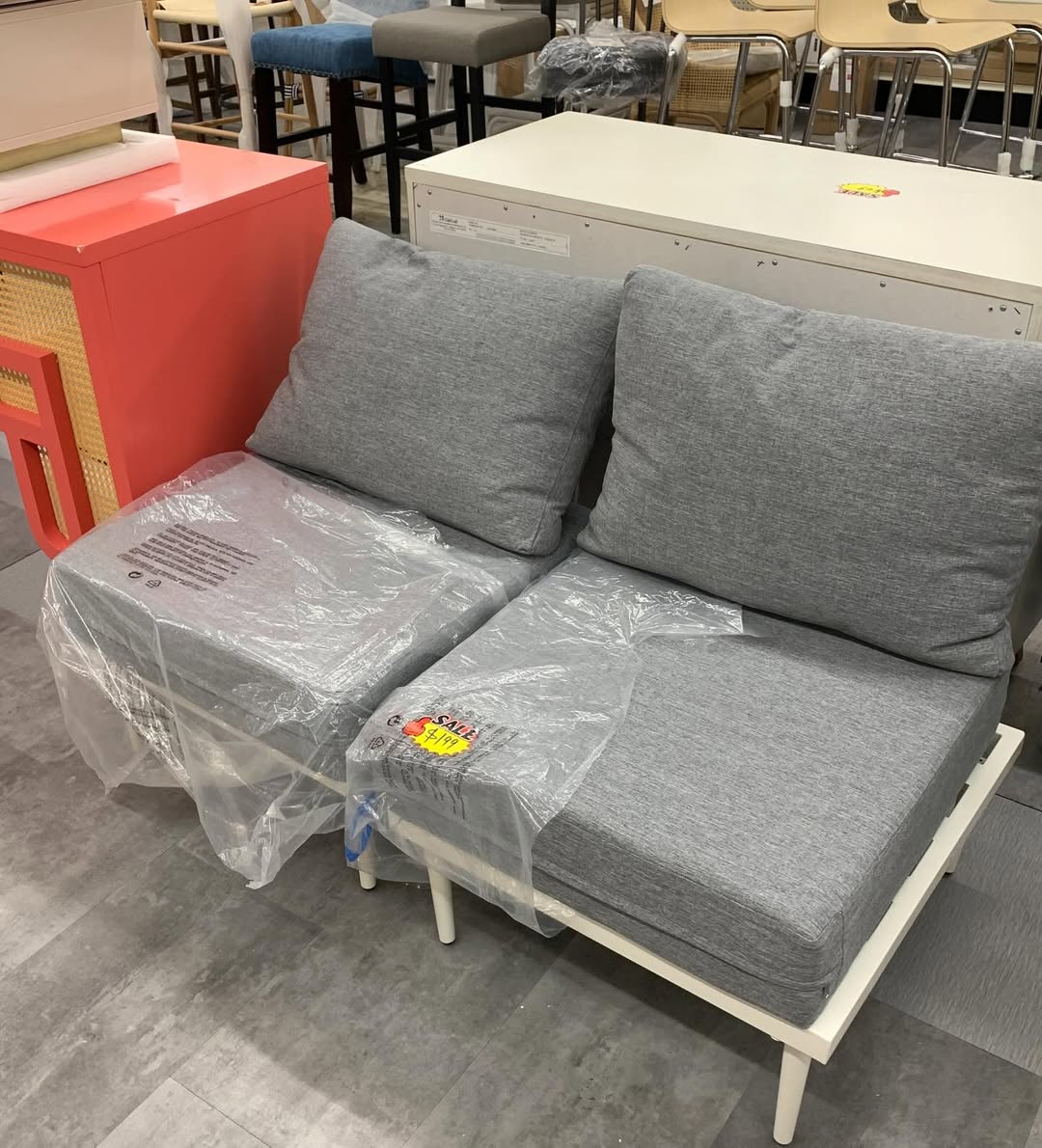 Grey upholstered loveseat