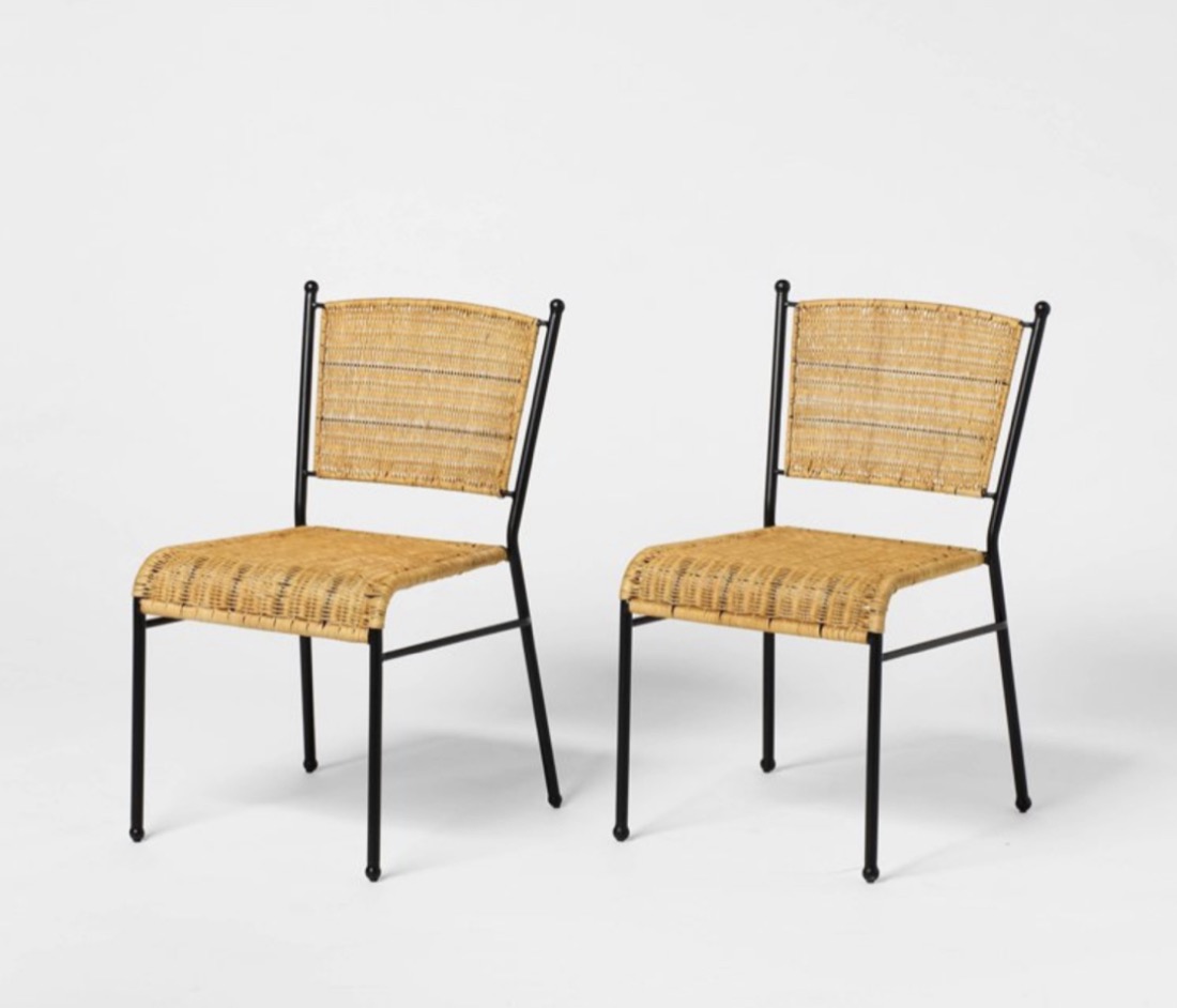 Pair of natural rattan side chairs with black metal frames