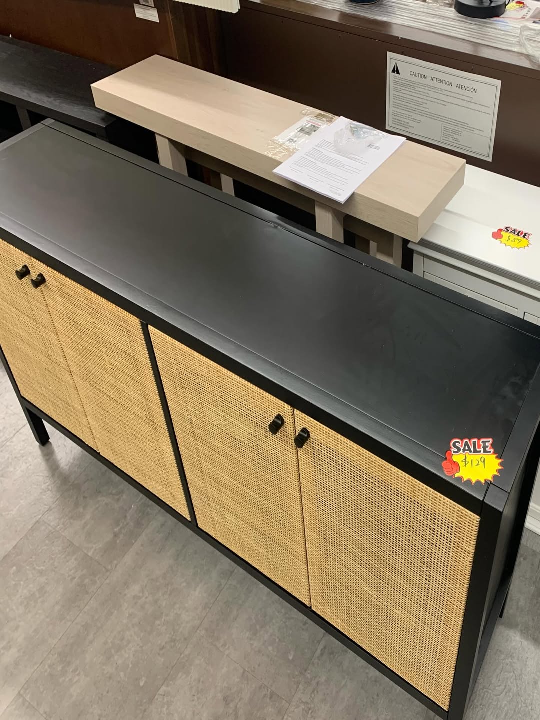 Black sideboard with rattan-front doors
